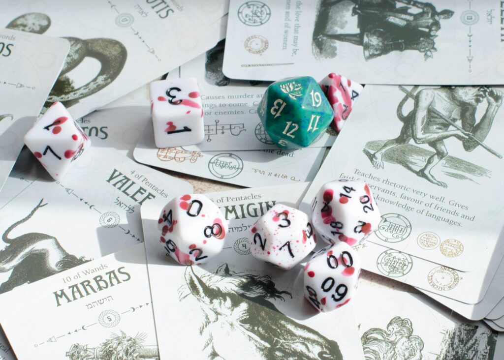 pexels-photo-20393802-20393802 Tarot cards and gaming dice scattered, a blend of mysticism and tabletop gaming.
